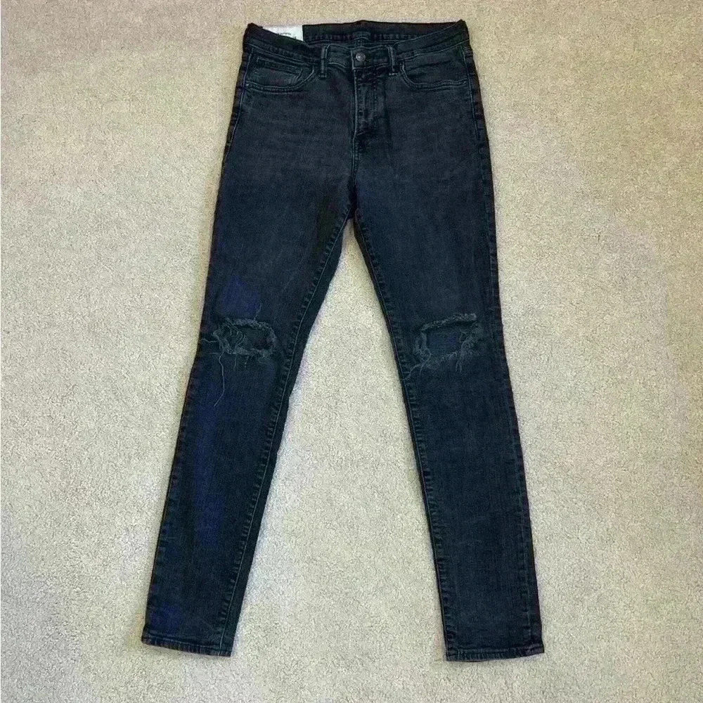 H&M black distressed skinny jeans in size 32